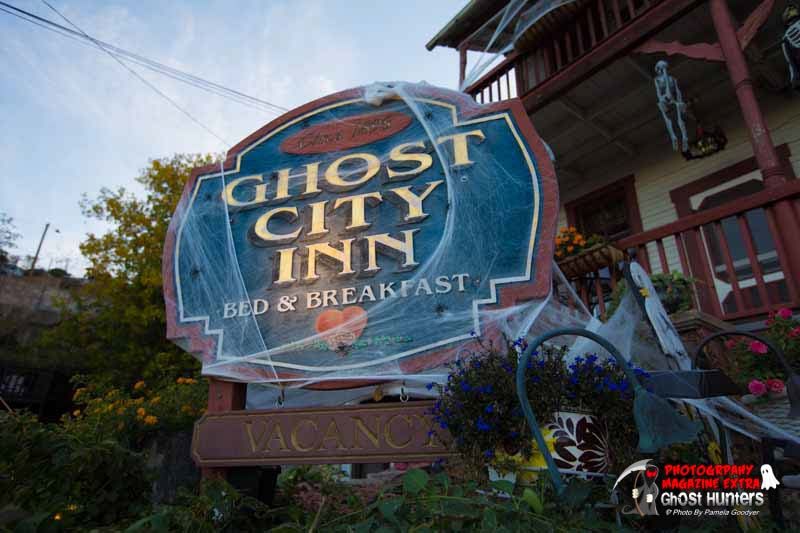 Go City Inn bed and breakfast vacancy sign covered with ghost webs, cobwebs.