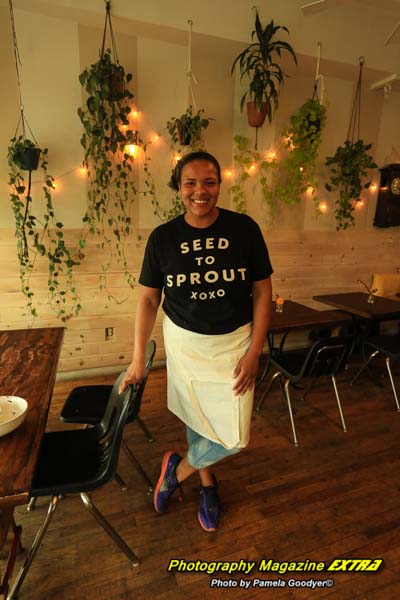 Seed to Sprout restaurant organic. Woman manager, wearing a shirt, matching the title.