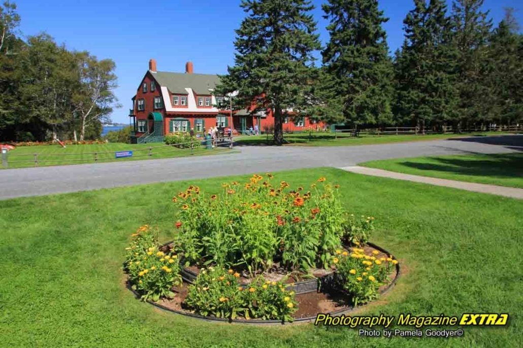 g Campobello Island Canada Roosevelt house Beautiful Red House with a flower garden in the foreground.