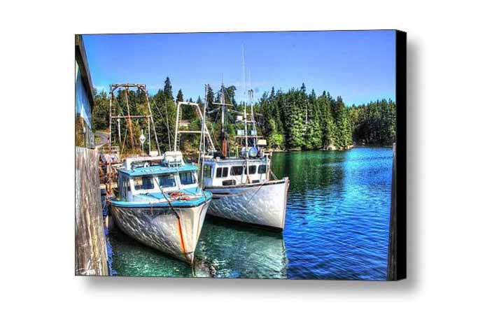 Picture of two boats on a canvas.