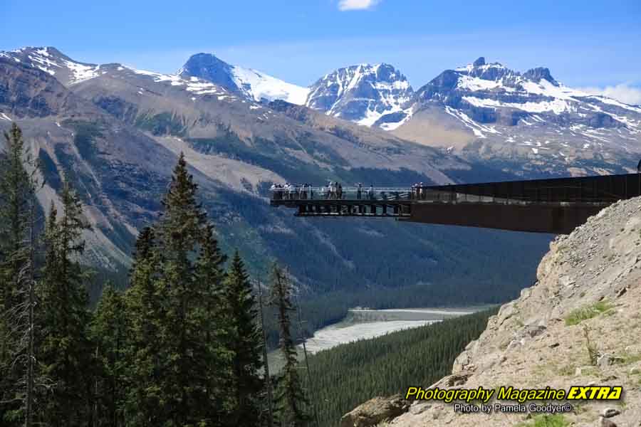 Skywalk with people on it on a very high area, overlooking the Canadian Rockies.