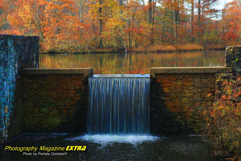 Waterfall close up with fall foliage colors.