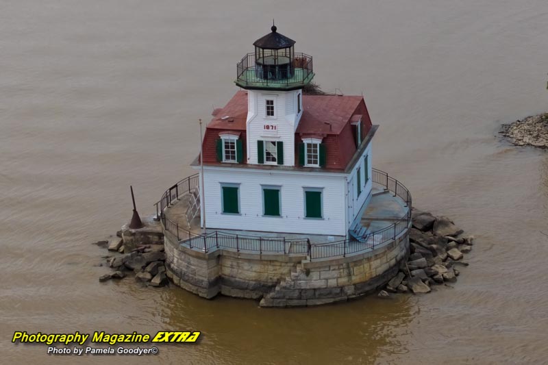 ESOP puts Lighthouse from the sky in a drone picture.